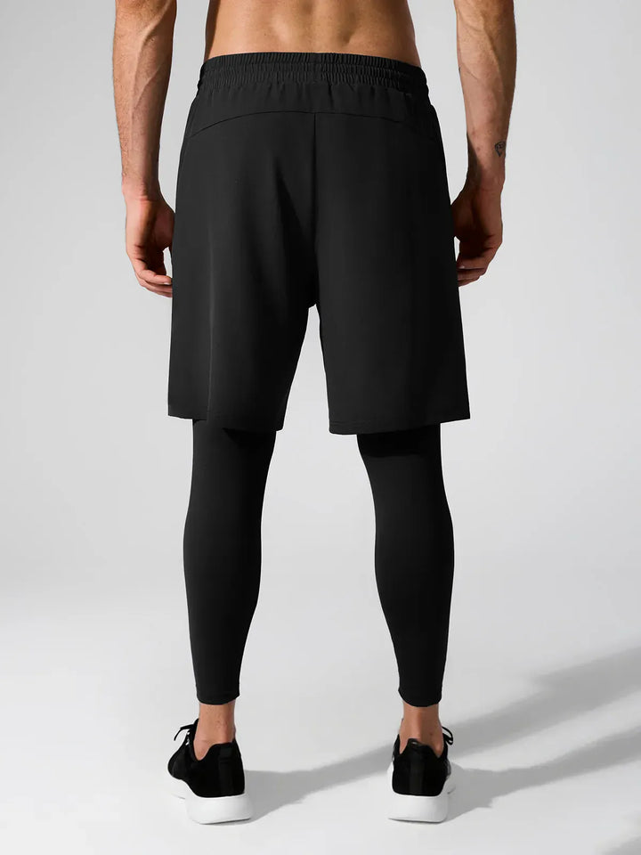 A model wearing a BRXL® 2-in-1 Training Pants for Men in