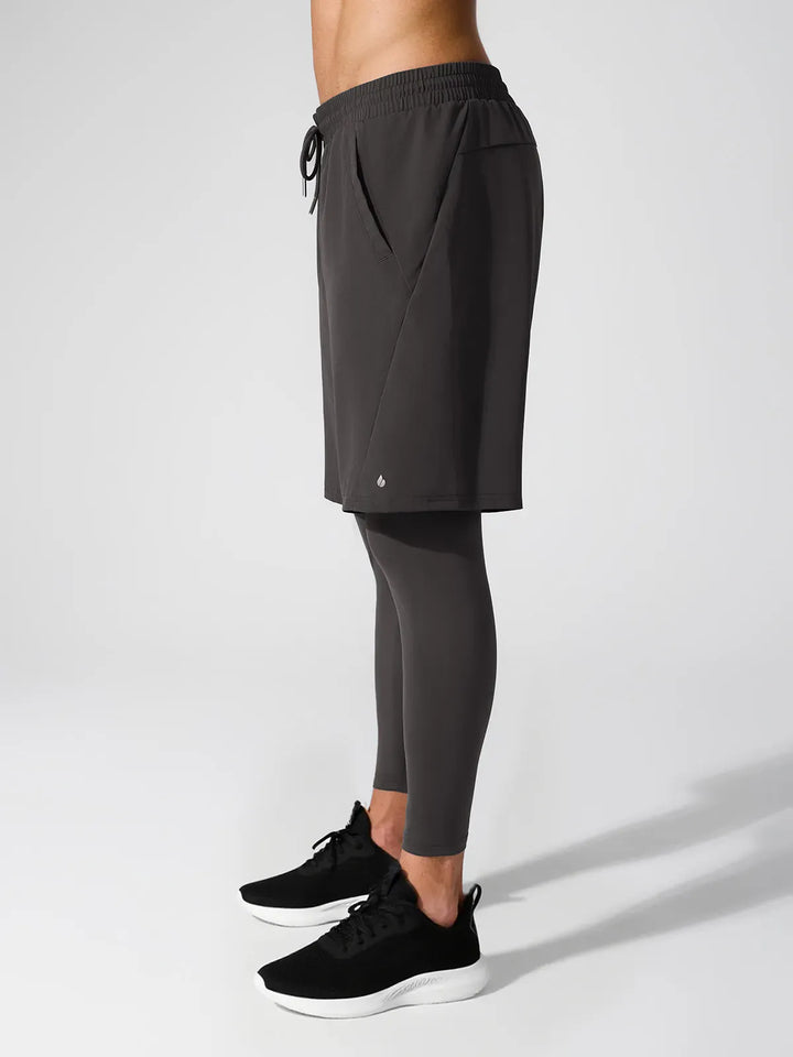 A model wearing a BRXL® 2-in-1 Training Pants for Men in