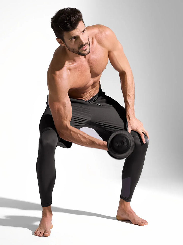 A model wearing a BRXL® 2-in-1 Training Pants for Men in