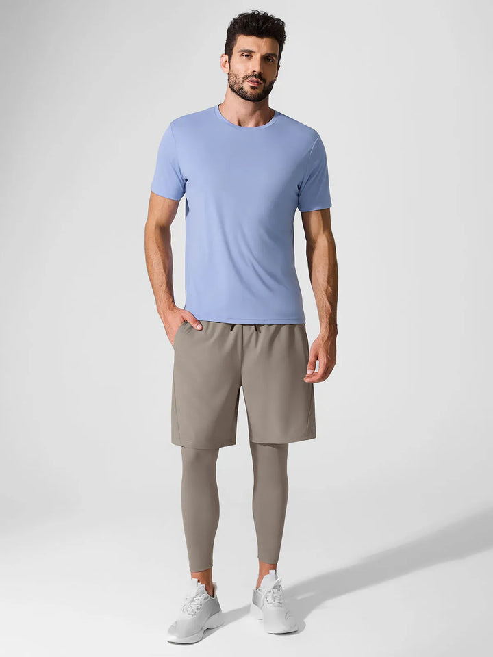A model wearing a BRXL® 2-in-1 Training Pants for Men in