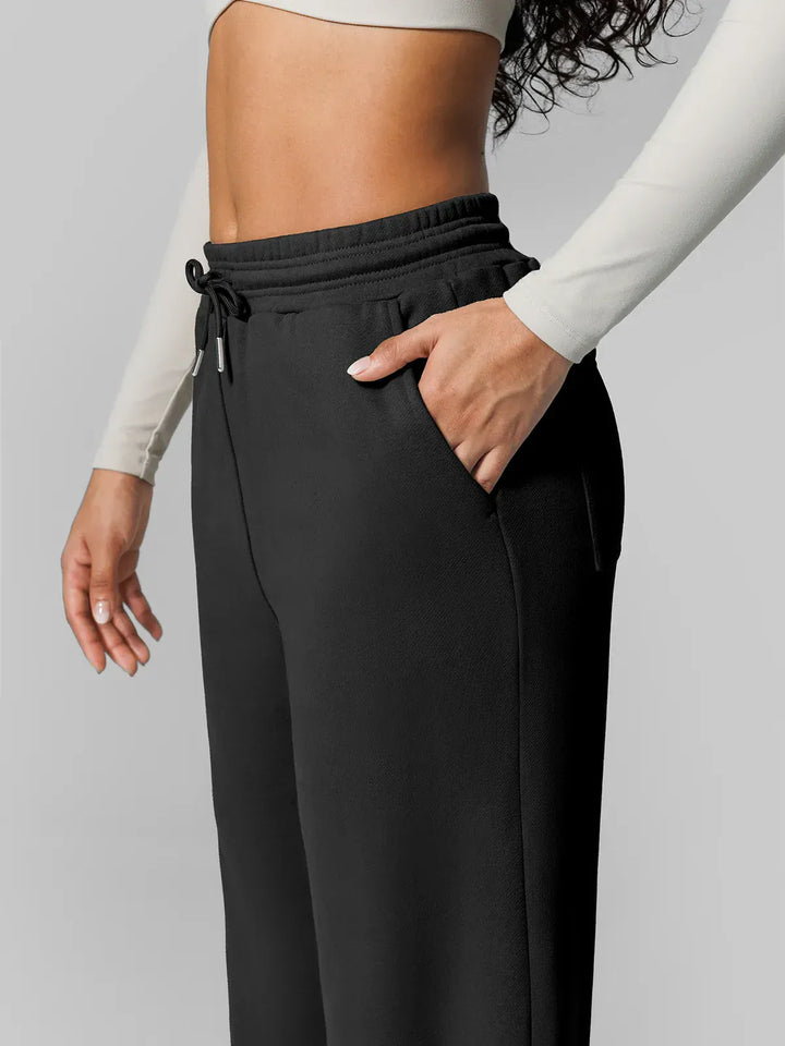 A model wearing a BRXL® Athleisure Drawstring Waist  Wide Leg Sweatpants in