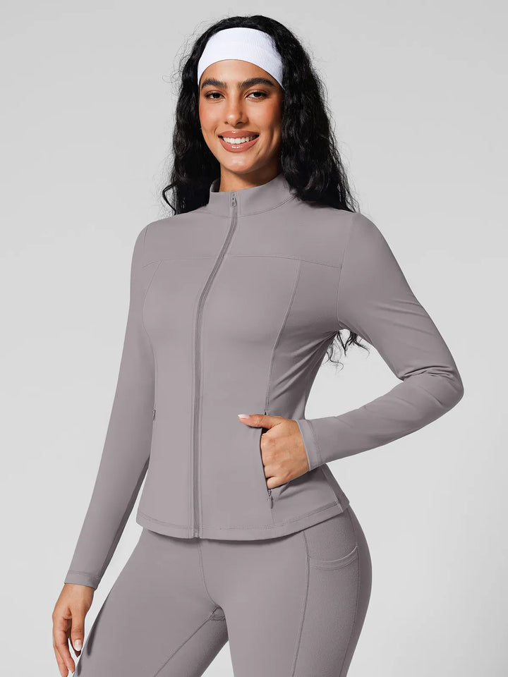 A model wearing a BRXL® Athleisure Hidden Pockets Cropped Jacket in