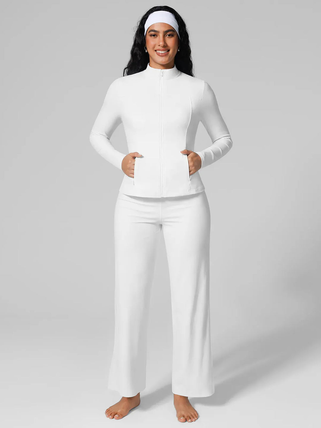 A model wearing a BRXL® Athleisure Hidden Pockets Cropped Jacket in