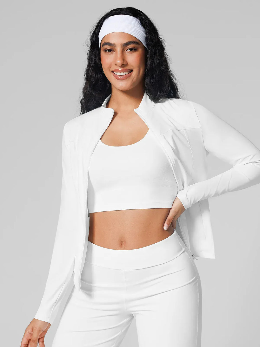 A model wearing a BRXL® Athleisure Hidden Pockets Cropped Jacket in