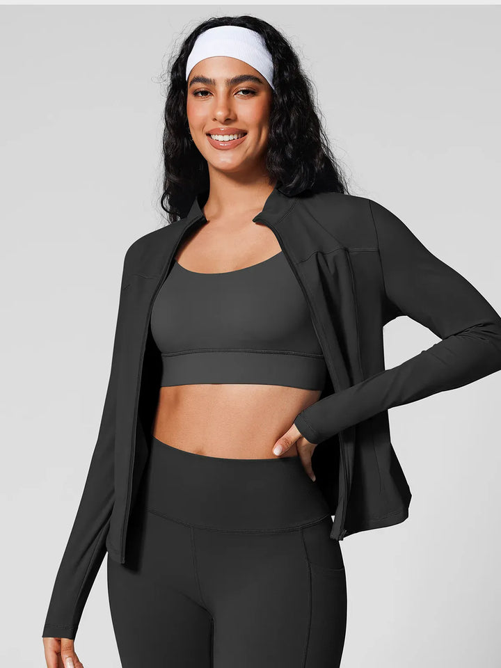 A model wearing a BRXL® Athleisure Hidden Pockets Cropped Jacket in Black / XS