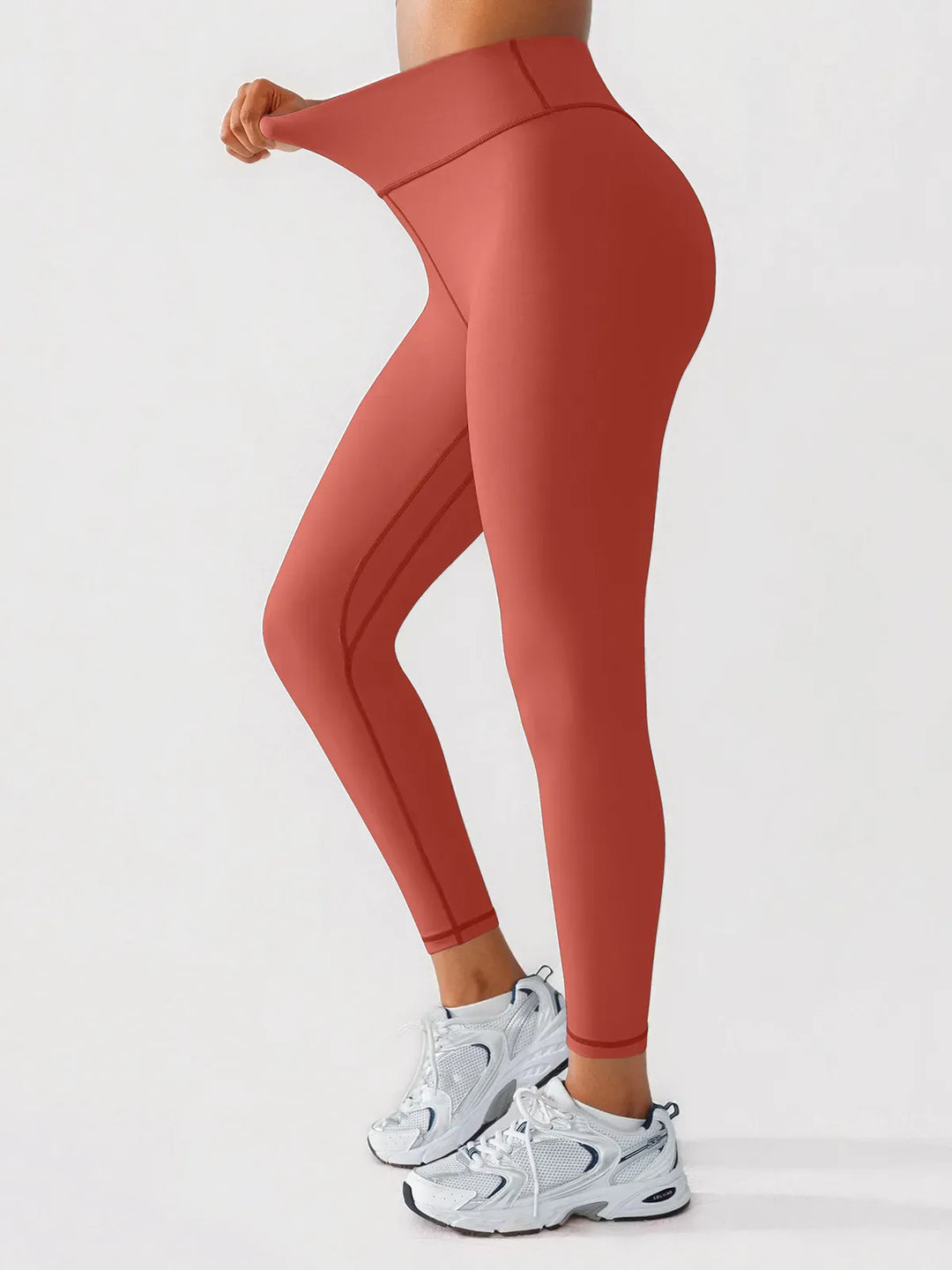 A model wearing a BRXL® BrxlGrit™ Scrunch High Rise Gym Leggings in