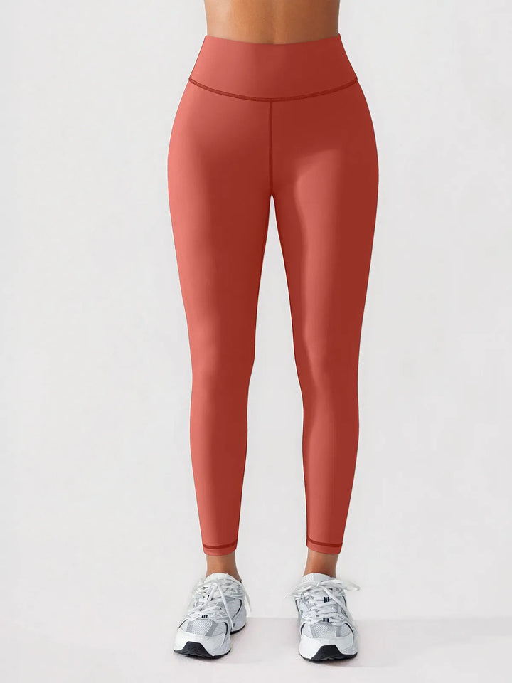 A model wearing a BRXL® BrxlGrit™ Scrunch High Rise Gym Leggings in