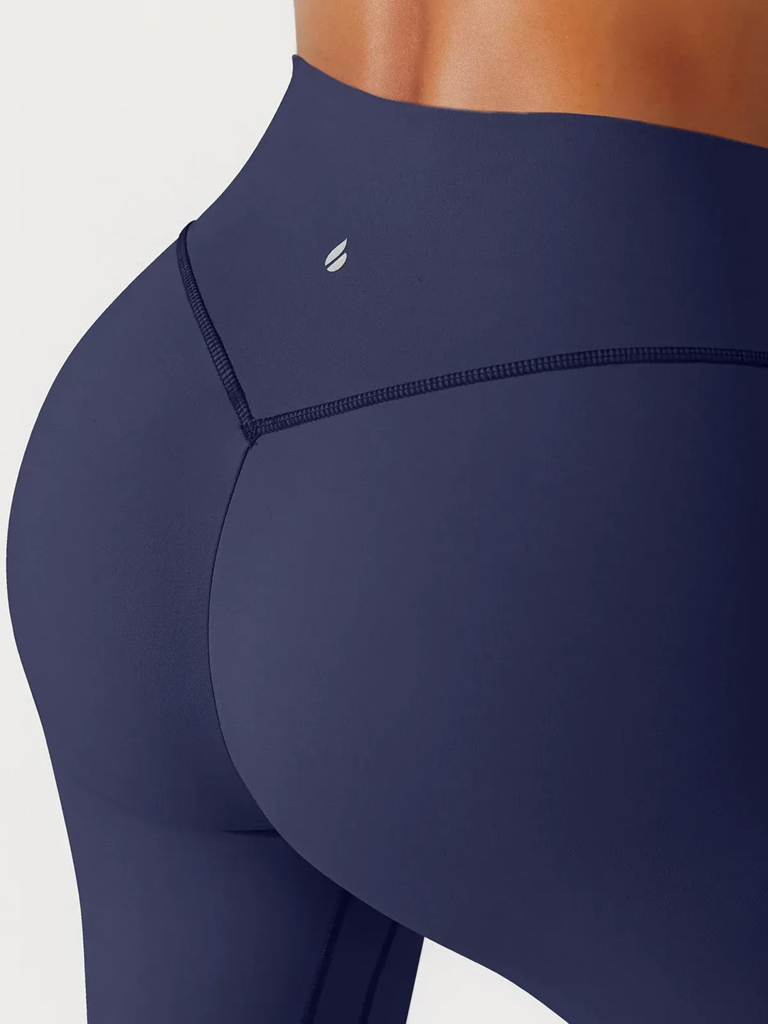 A model wearing a BRXL® BrxlGrit™ Scrunch High Rise Gym Leggings in