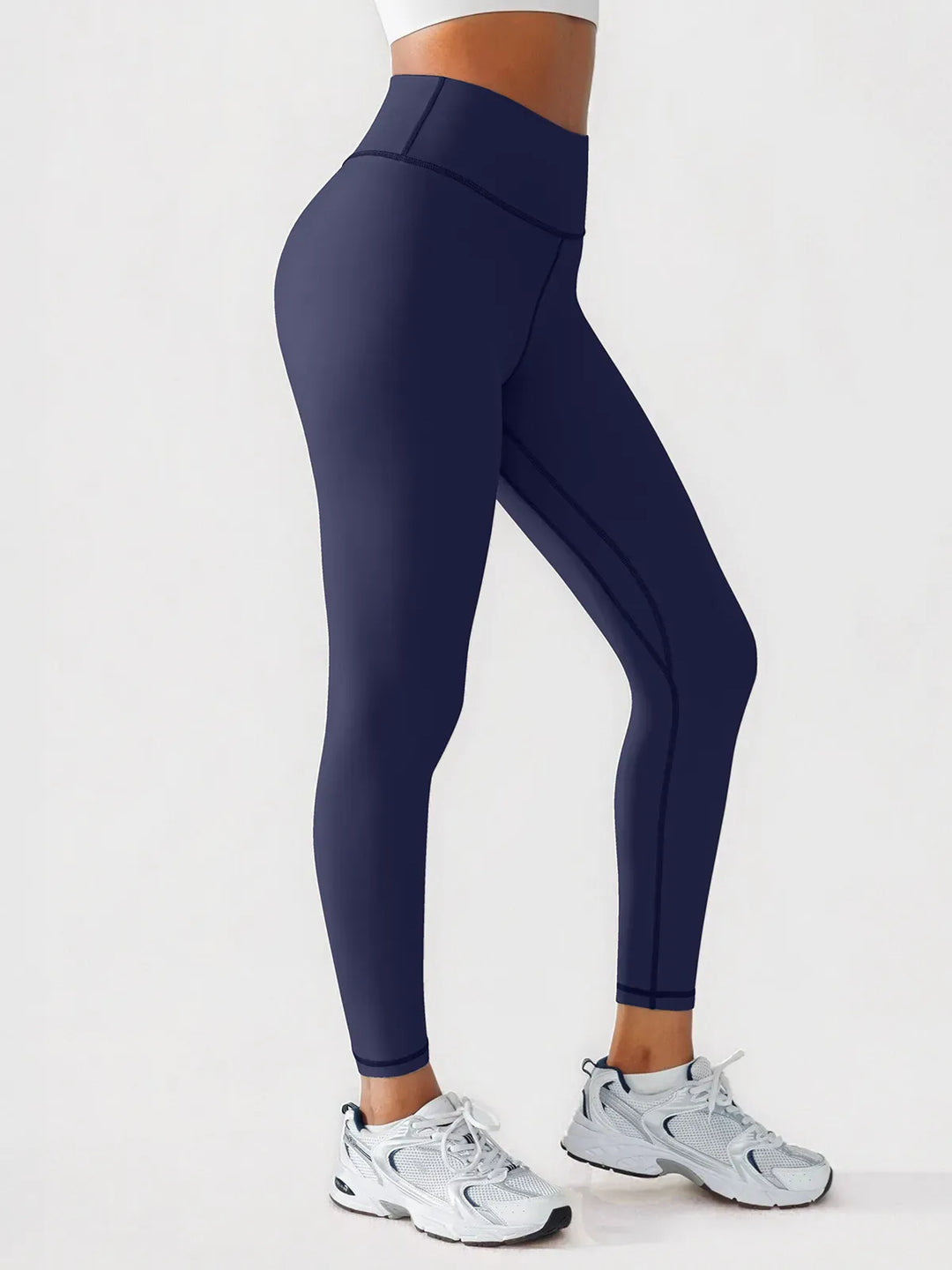 A model wearing a BRXL® BrxlGrit™ Scrunch High Rise Gym Leggings in