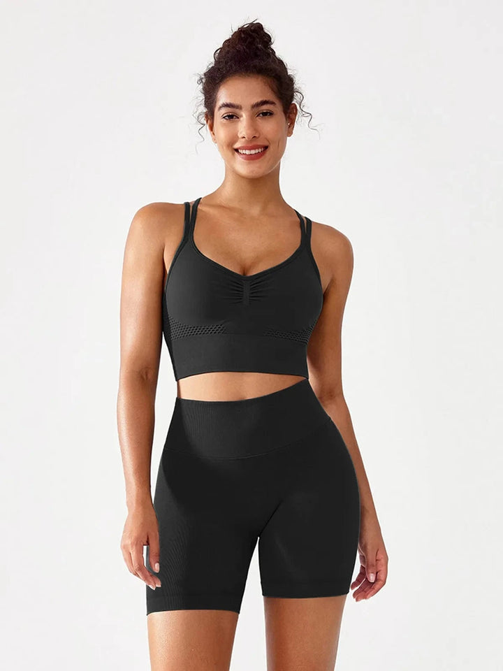 A model wearing a BRXL® BrxlGrit™ Seamless Scrunch Butt Workout Shorts in