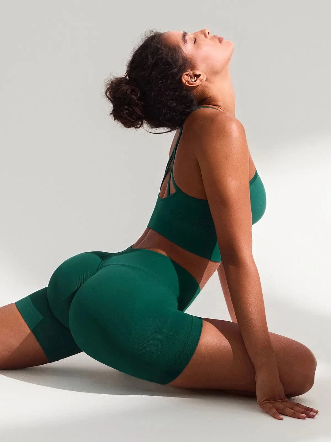 A model wearing a BRXL® BrxlGrit™ Seamless Scrunch Butt Workout Shorts in