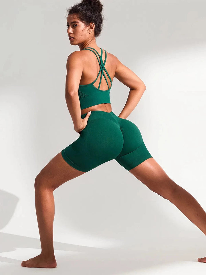 A model wearing a BRXL® BrxlGrit™ Seamless Scrunch Butt Workout Shorts in