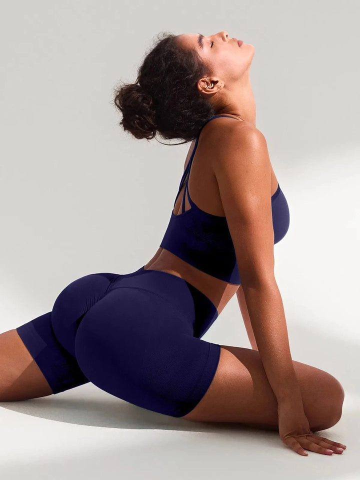 A model wearing a BRXL® BrxlGrit™ Seamless Scrunch Butt Workout Shorts in