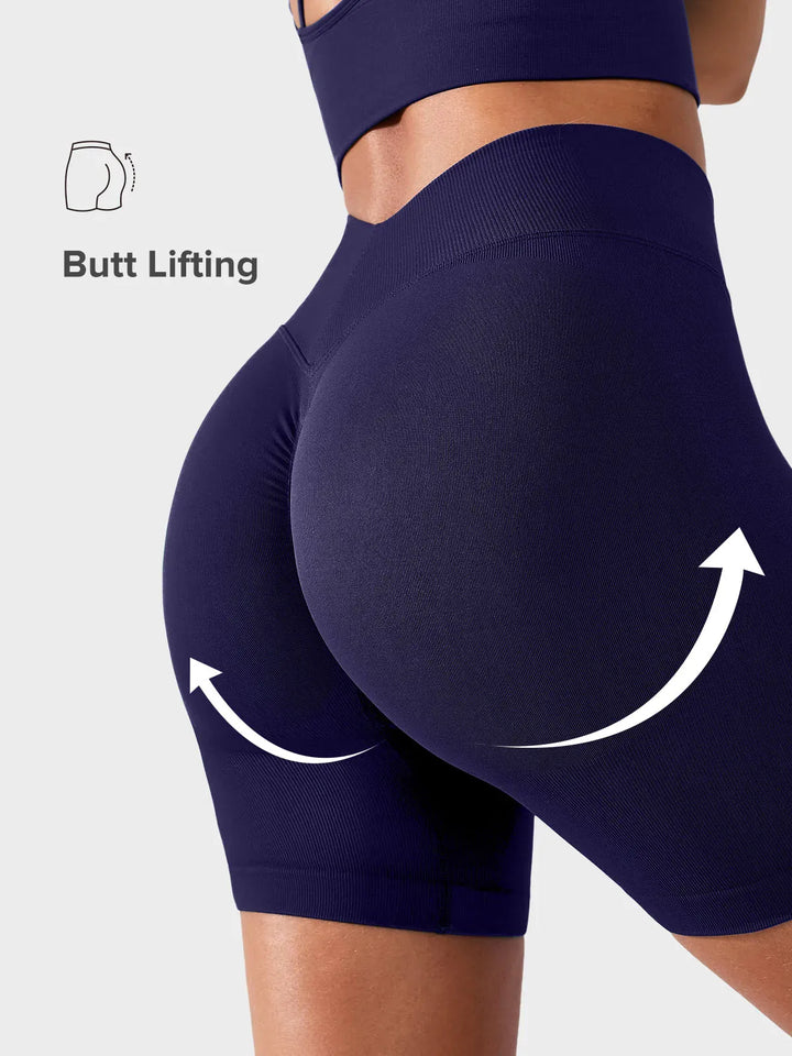 A model wearing a BRXL® BrxlGrit™ Seamless Scrunch Butt Workout Shorts in