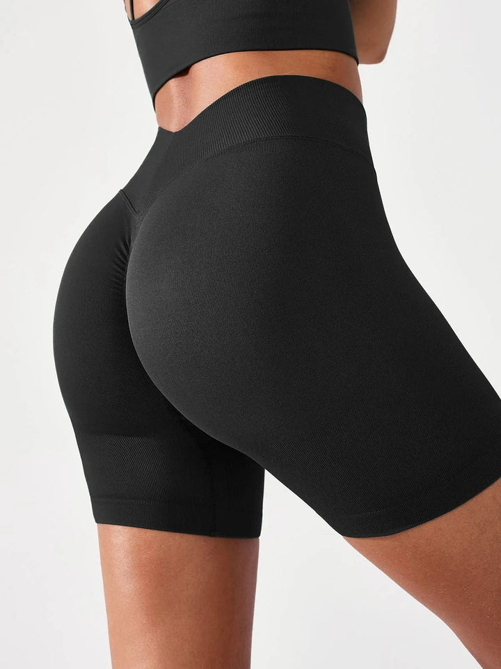 A model wearing a BRXL® BrxlGrit™ Seamless Scrunch Butt Workout Shorts in Black / S