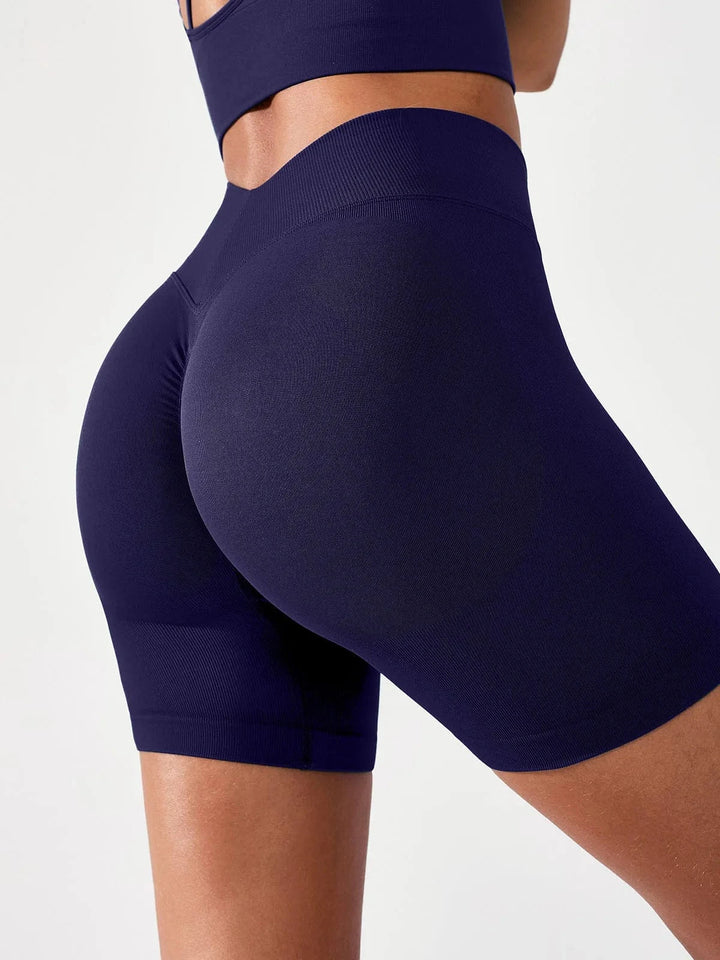 A model wearing a BRXL® BrxlGrit™ Seamless Scrunch Butt Workout Shorts in Blue / S