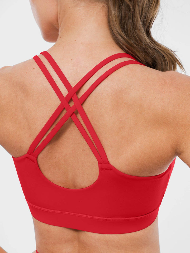 A model wearing a BRXL® BrxlZero™ Cross Back Strappy Sports Bra in