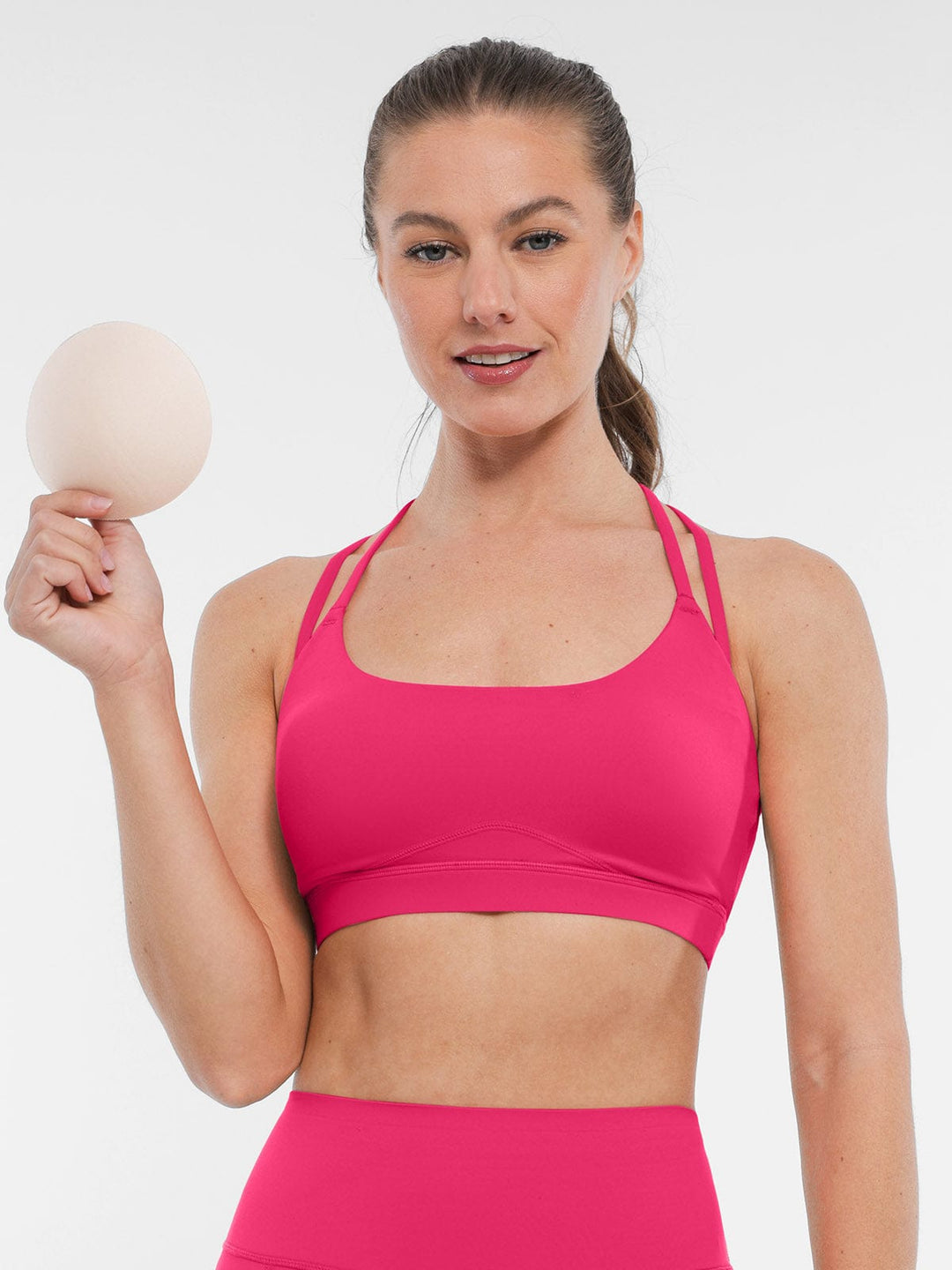 A model wearing a BRXL® BrxlZero™ Cross Back Strappy Sports Bra in
