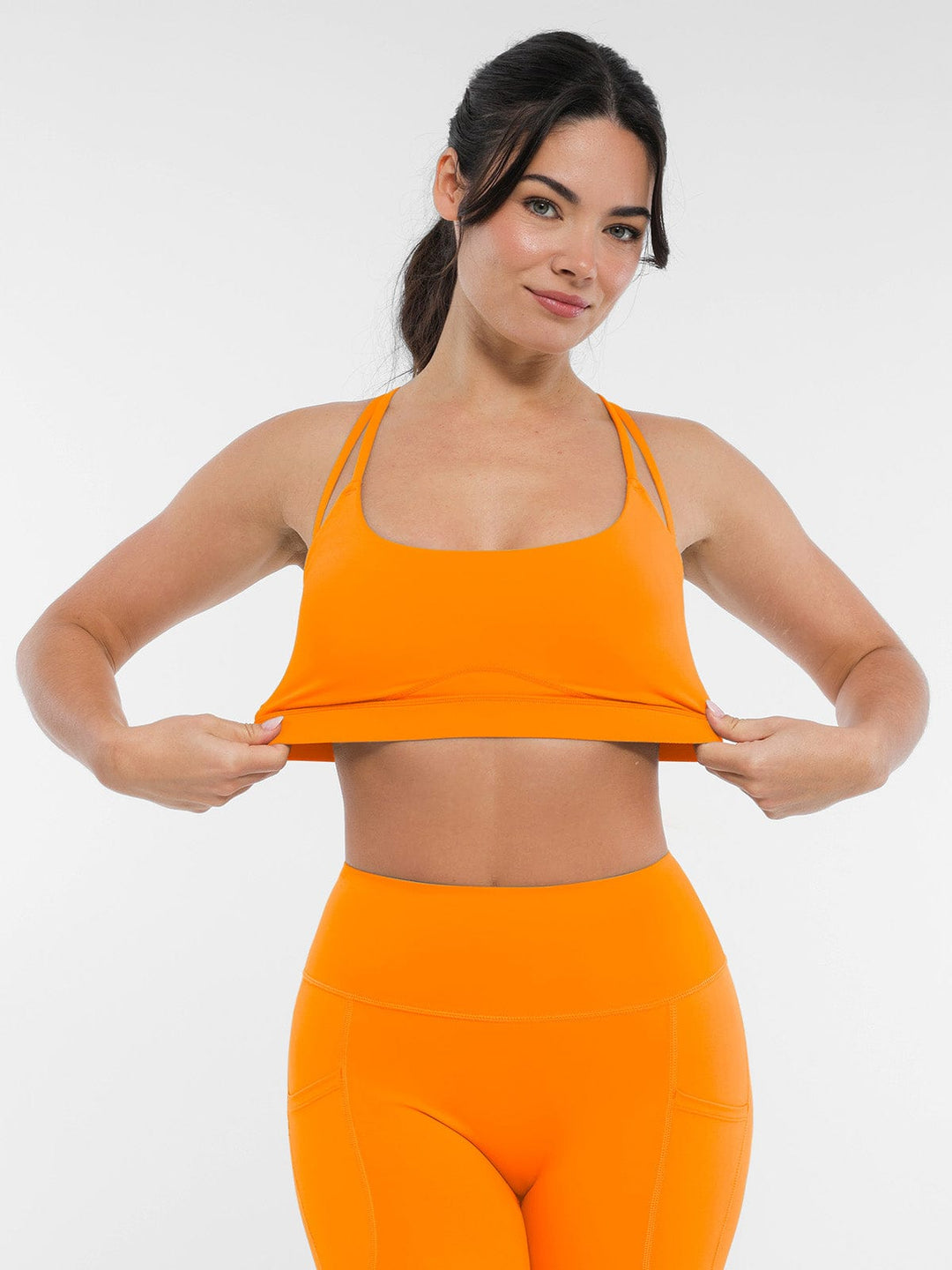 A model wearing a BRXL® BrxlZero™ Cross Back Strappy Sports Bra in