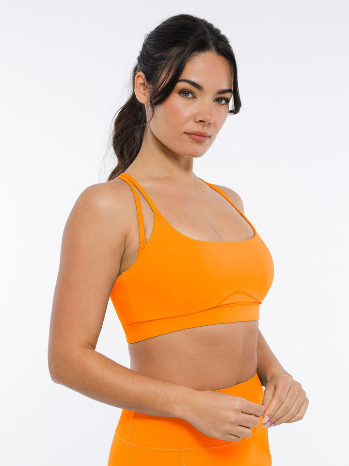 A model wearing a BRXL® BrxlZero™ Cross Back Strappy Sports Bra in