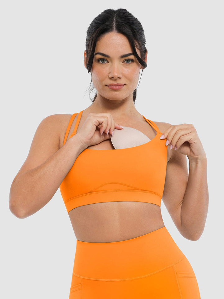 A model wearing a BRXL® BrxlZero™ Cross Back Strappy Sports Bra in