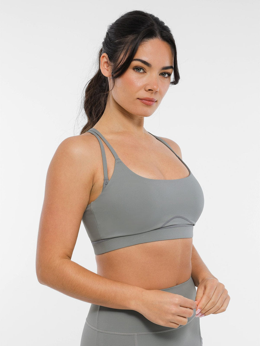 A model wearing a BRXL® BrxlZero™ Cross Back Strappy Sports Bra in