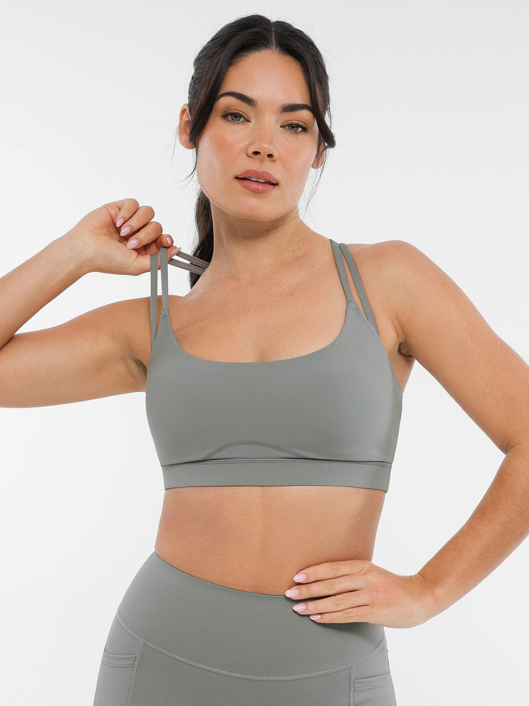 A model wearing a BRXL® BrxlZero™ Cross Back Strappy Sports Bra in