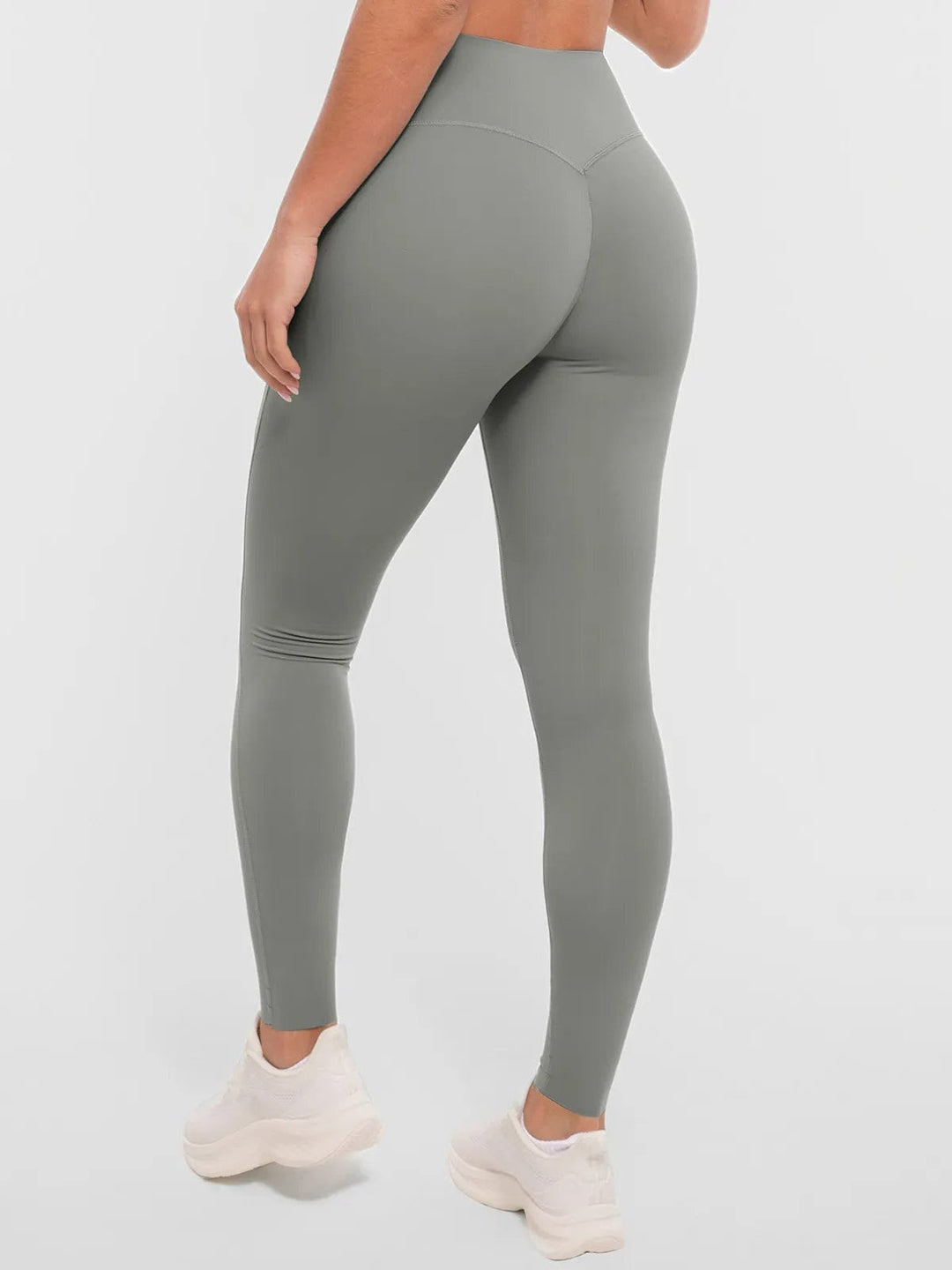 A model wearing a BRXL® BrxlZero™ High Rise Buttery Soft Yoga Leggings in