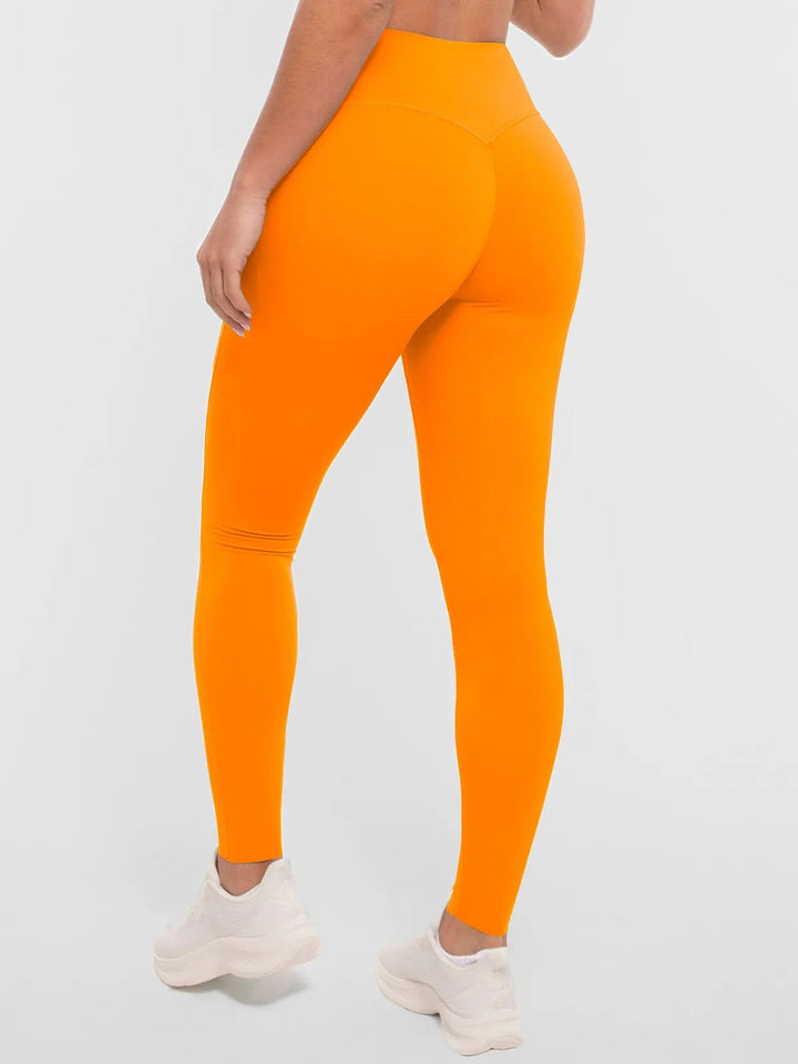 A model wearing a BRXL® BrxlZero™ High Rise Buttery Soft Yoga Leggings in