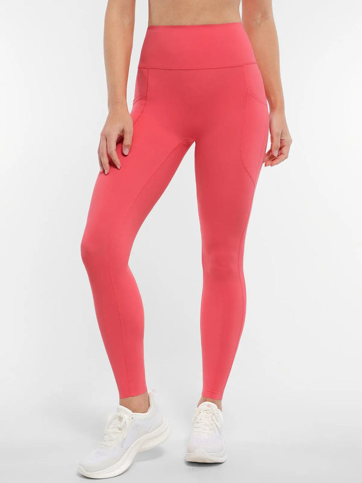 A model wearing a BRXL® BrxlZero™ High Rise Buttery Soft Yoga Leggings in