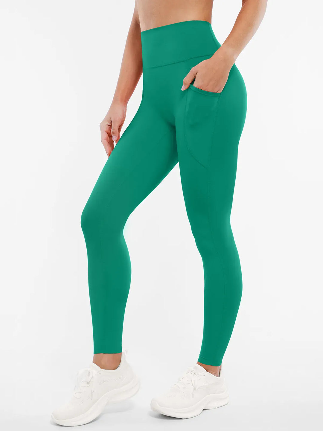 A model wearing a BRXL® BrxlZero™ High Rise Buttery Soft Yoga Leggings in Green / XS