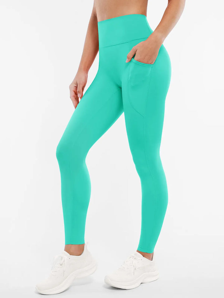 A model wearing a BRXL® BrxlZero™ High Rise Buttery Soft Yoga Leggings in Mint Green / XS