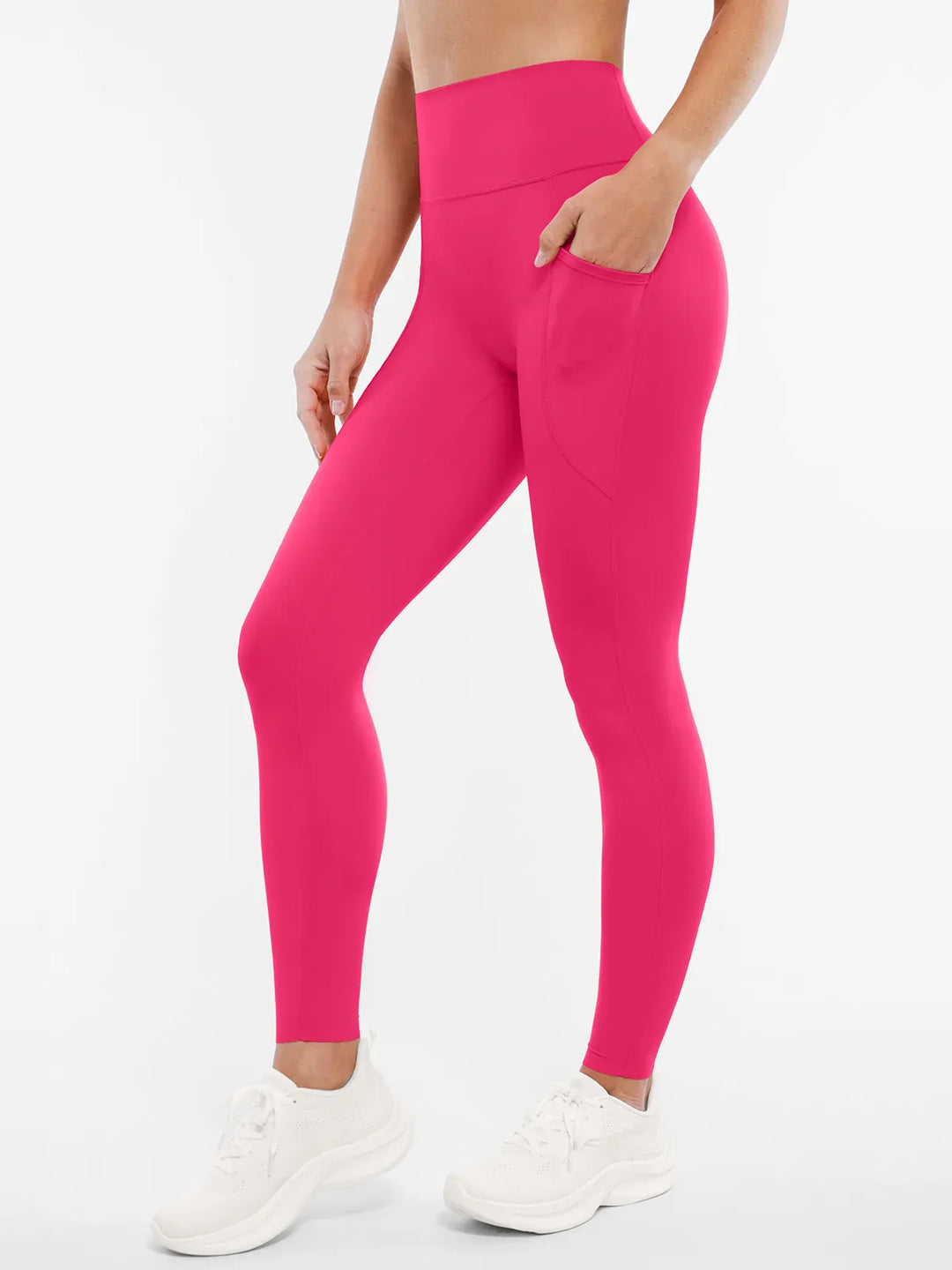 A model wearing a BRXL® BrxlZero™ High Rise Buttery Soft Yoga Leggings in Pink / XS