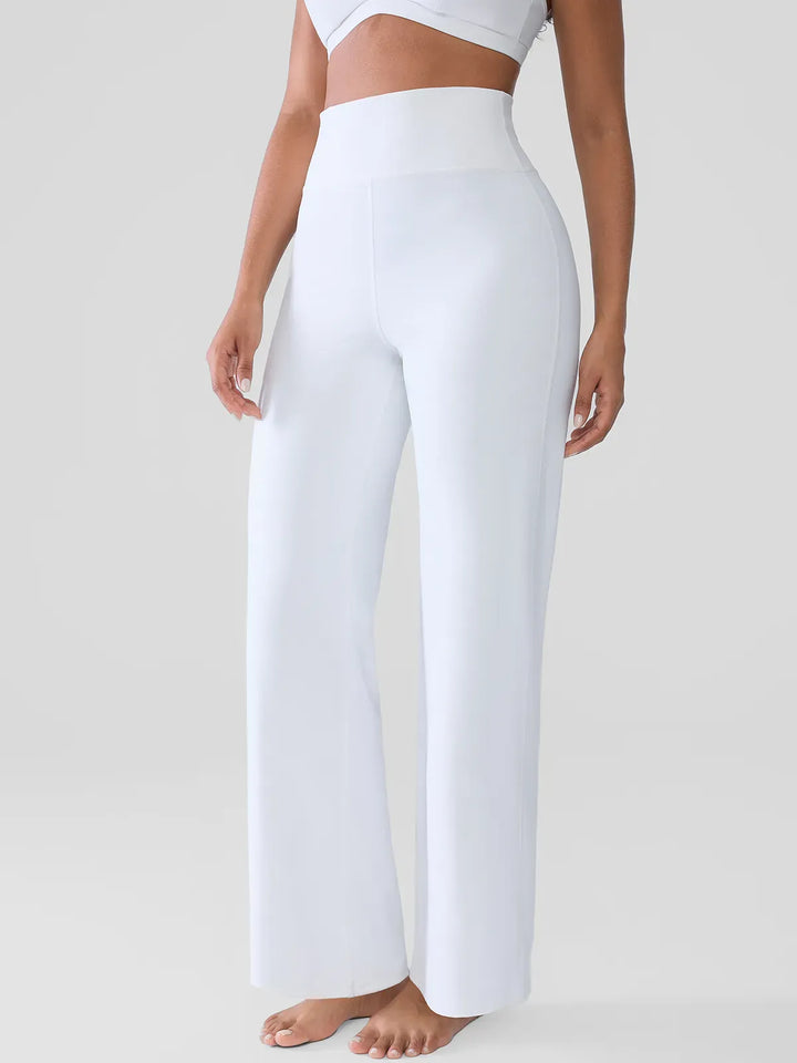 A model wearing a BRXL® Butt Lift Wide Leg Workout Pants in