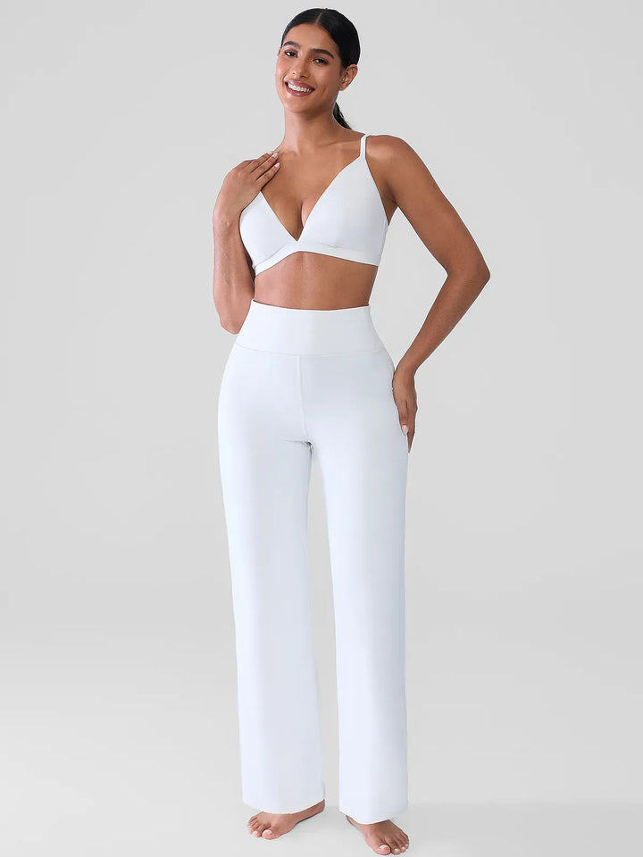 A model wearing a BRXL® Butt Lift Wide Leg Workout Pants in