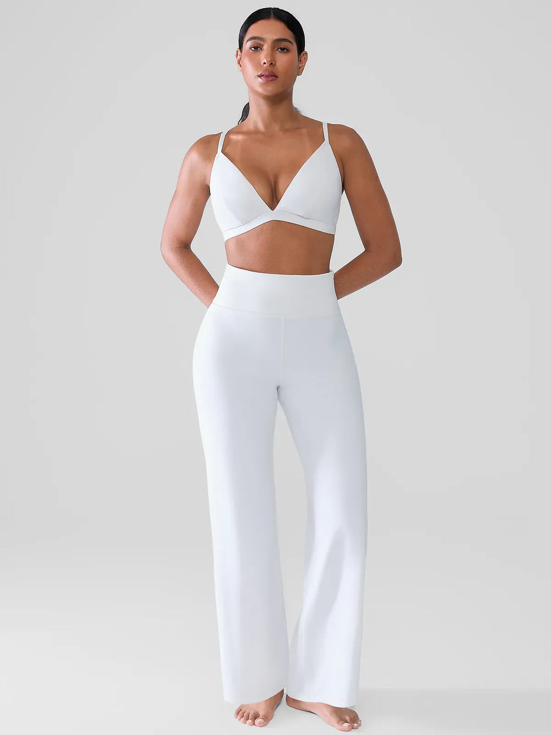 A model wearing a BRXL® Butt Lift Wide Leg Workout Pants in