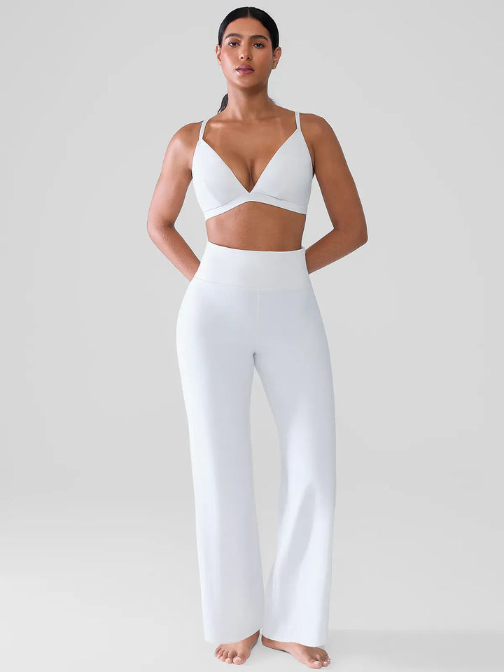 A model wearing a BRXL® Butt Lift Wide Leg Workout Pants in