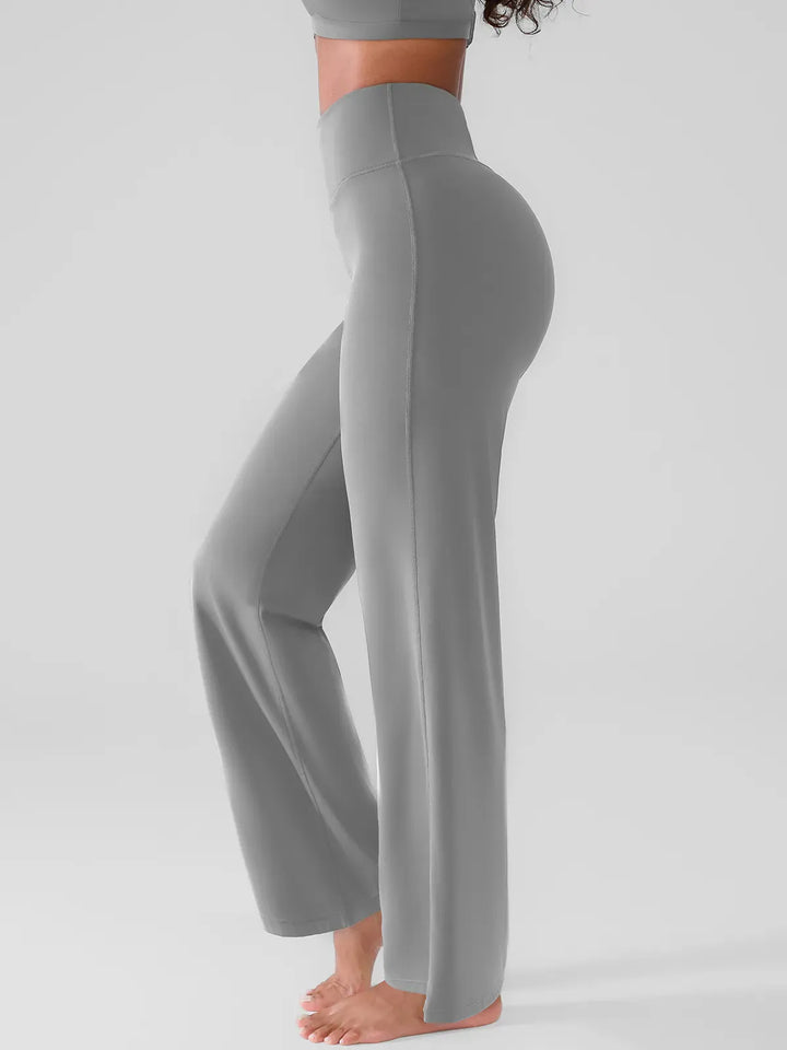 A model wearing a BRXL® Butt Lift Wide Leg Workout Pants in