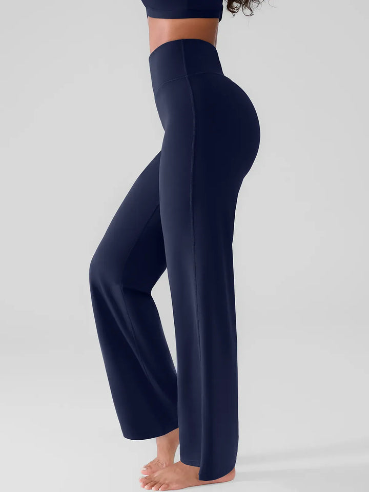 A model wearing a BRXL® Butt Lift Wide Leg Workout Pants in