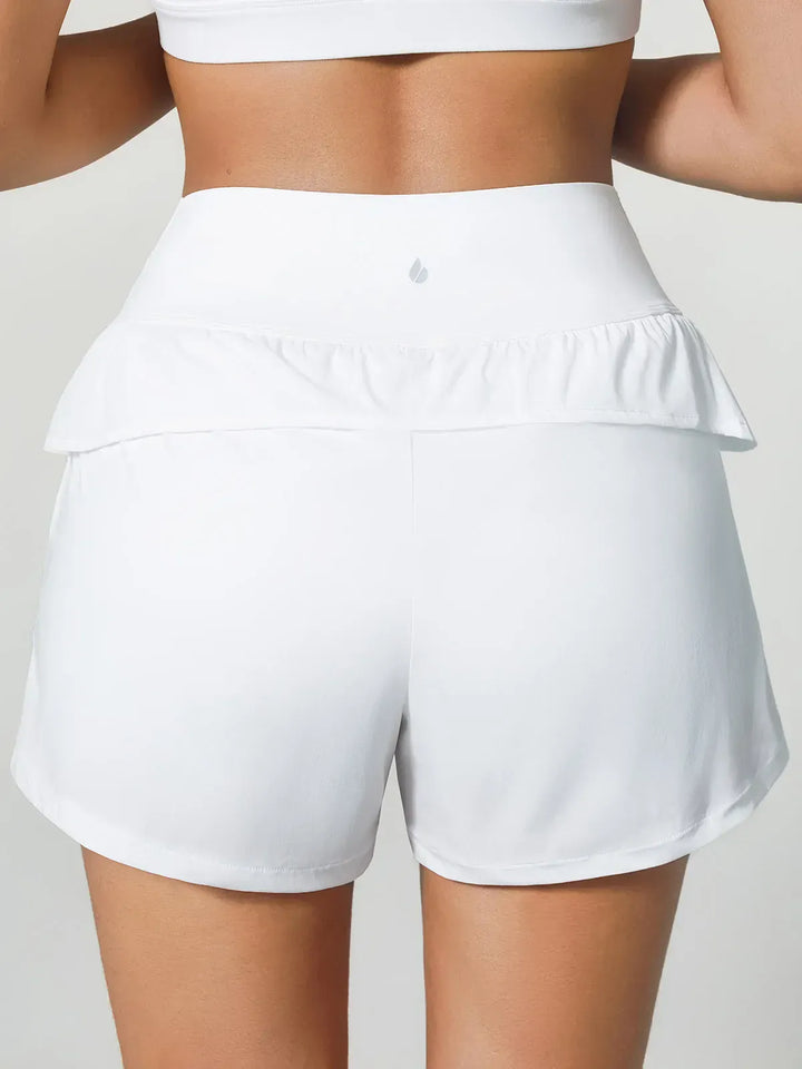 A model wearing a BRXL® Crossover Ruffled Flowy Shorts in