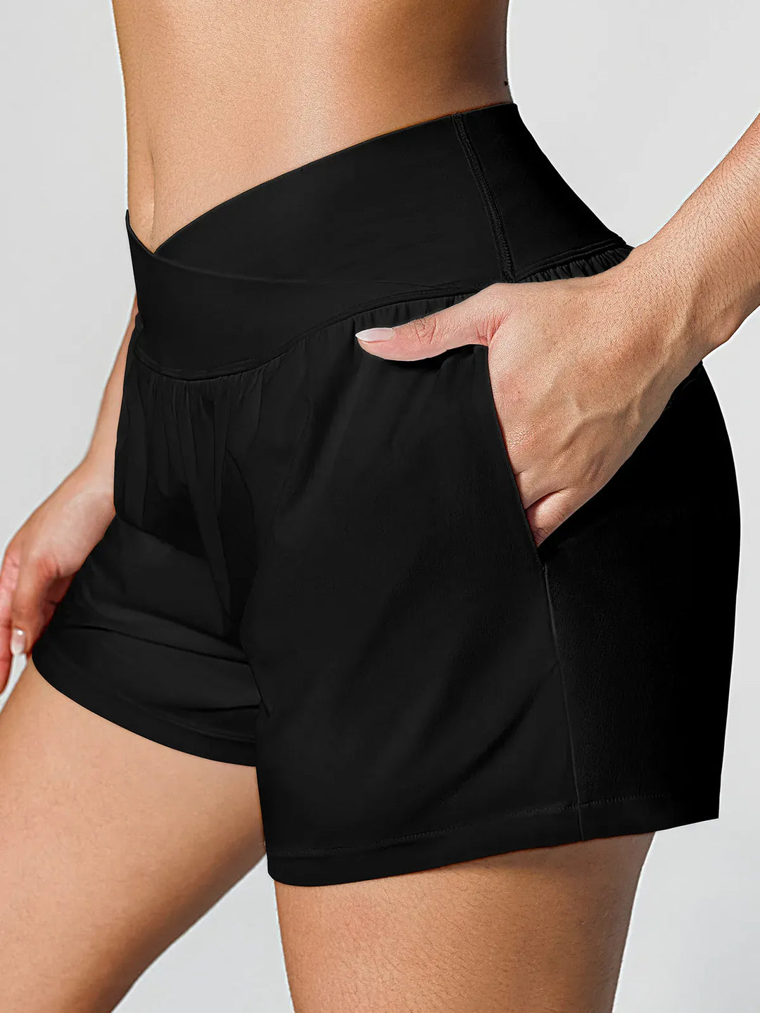 A model wearing a BRXL® Crossover Ruffled Flowy Shorts in