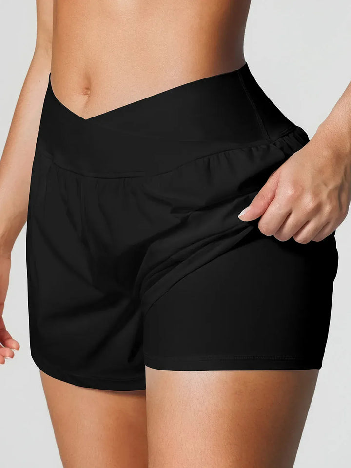 A model wearing a BRXL® Crossover Ruffled Flowy Shorts in