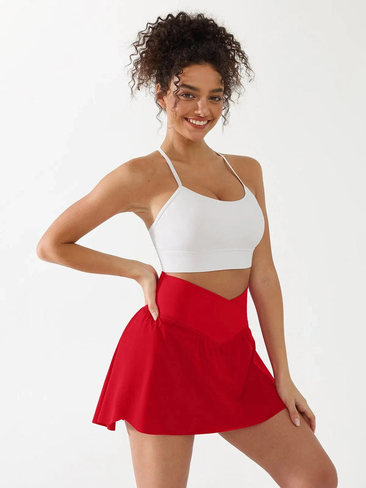 A model wearing a BRXL® Flow Y Racerback Bra with Low Cut and Spaghetti Straps in