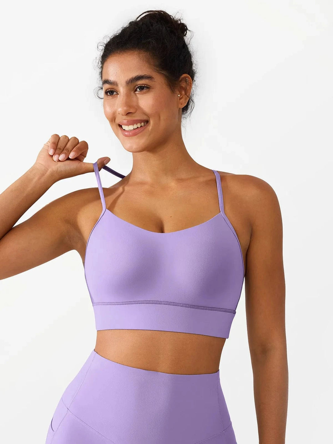 A model wearing a BRXL® Flow Y Racerback Bra with Low Cut and Spaghetti Straps in