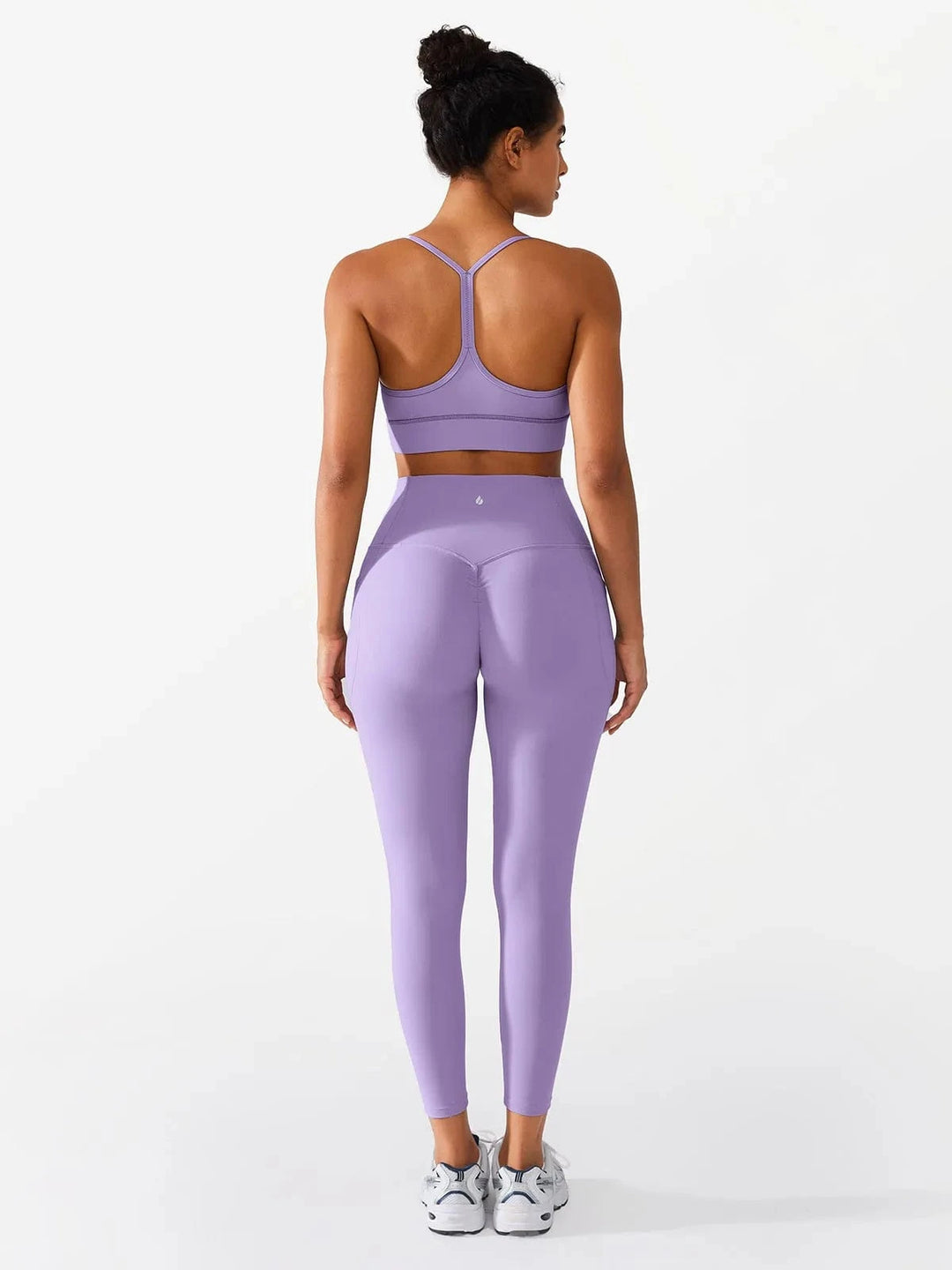 A model wearing a BRXL® Flow Y Racerback Bra with Low Cut and Spaghetti Straps in