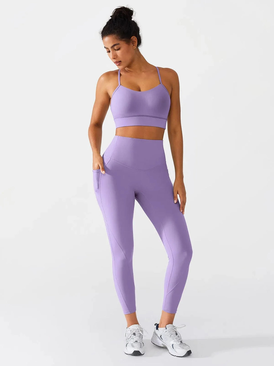 A model wearing a BRXL® Flow Y Racerback Bra with Low Cut and Spaghetti Straps in