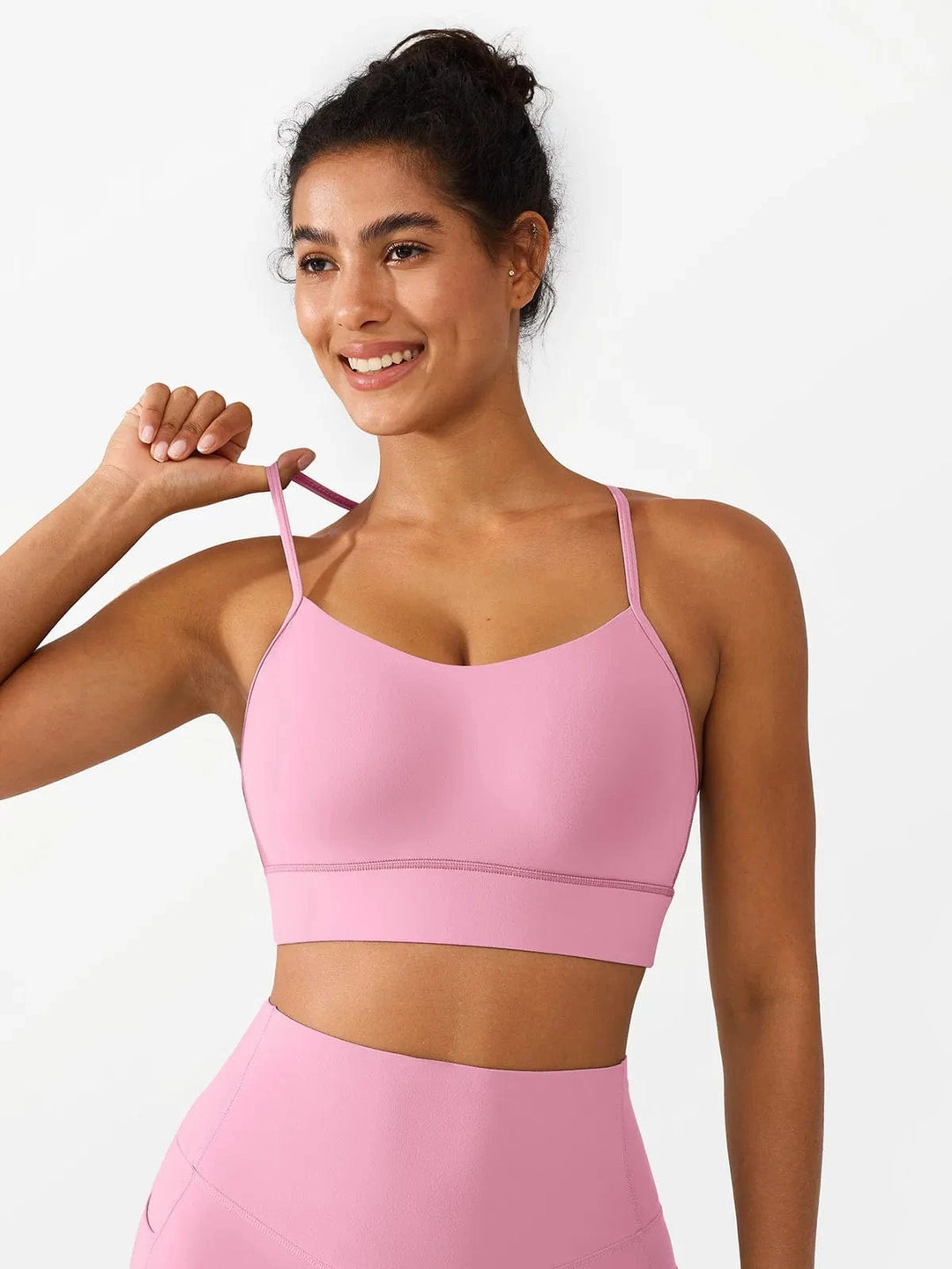 A model wearing a BRXL® Flow Y Racerback Bra with Low Cut and Spaghetti Straps in