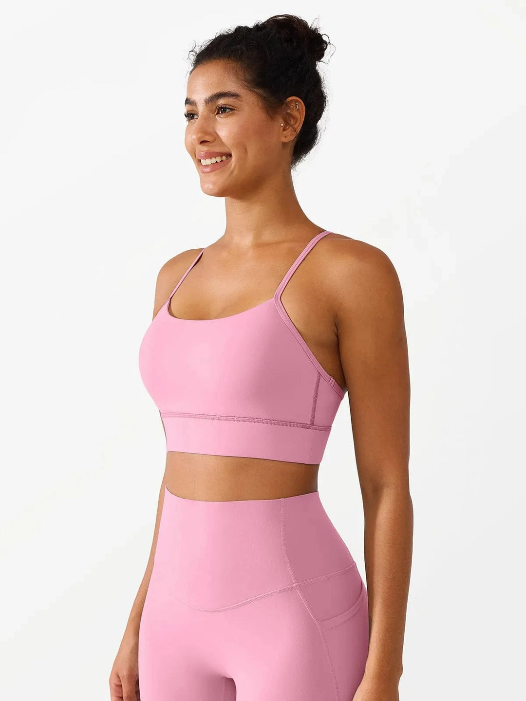 A model wearing a BRXL® Flow Y Racerback Bra with Low Cut and Spaghetti Straps in