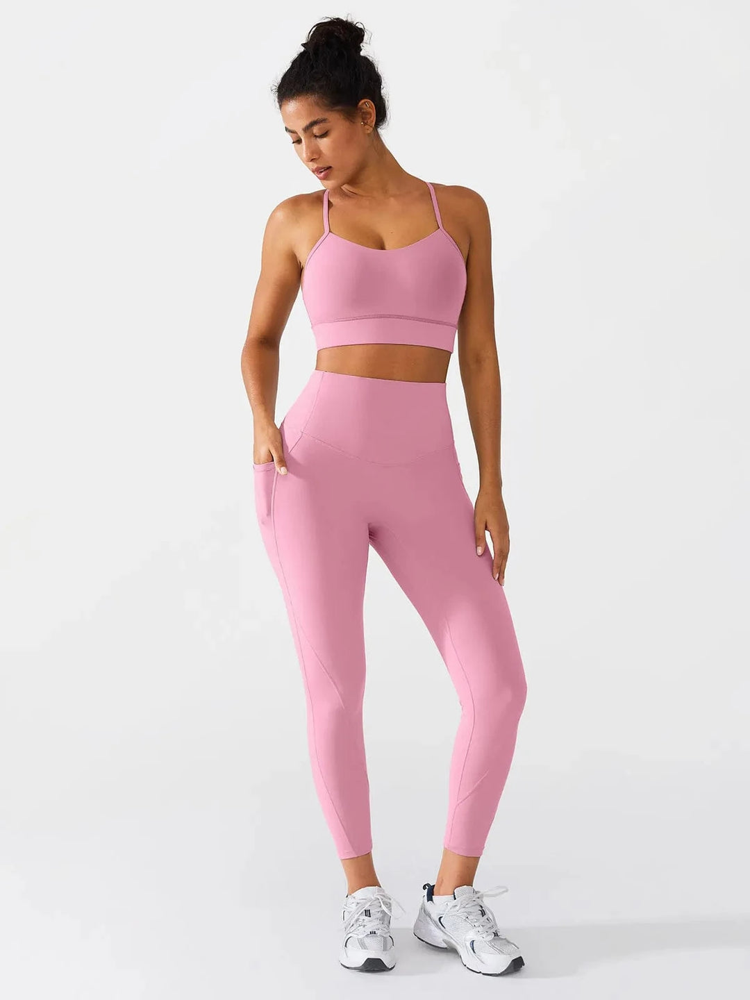 A model wearing a BRXL® Flow Y Racerback Bra with Low Cut and Spaghetti Straps in