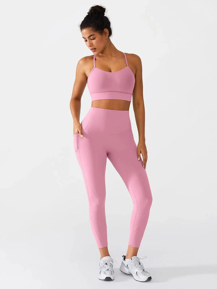 A model wearing a BRXL® Flow Y Racerback Bra with Low Cut and Spaghetti Straps in